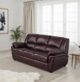 Sofa 3-osobowa, skórzana, z funkcją spania w kolorze burgund na tle eleganckiego salonu.