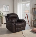 Skórzany fotel wypoczynkowy Boston w ciemnym kolorze z funkcją relaks na tle eleganckiego salonu
